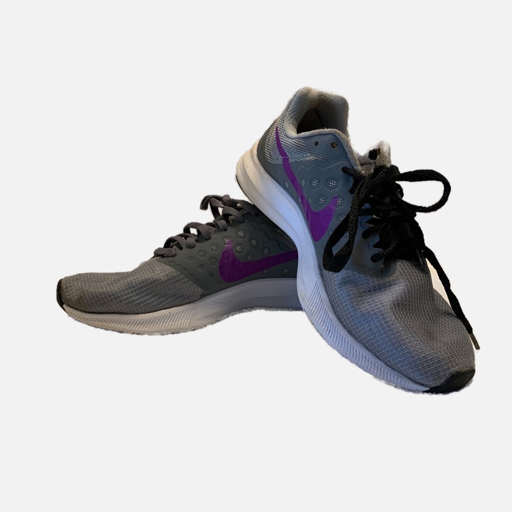 Nike running shoes.  Gray & purple, size 6.  Pre-owned & good condition.